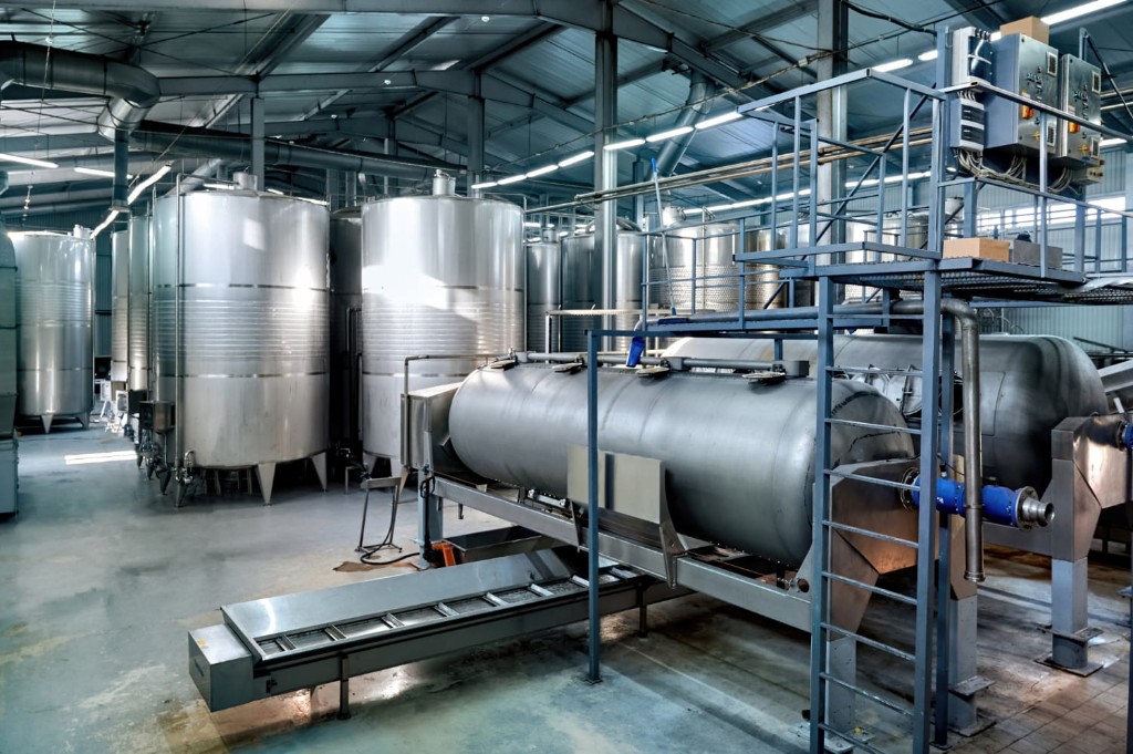 Food and beverage processing plant with stainless tanks